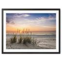 Póster duna en la playa al atardecer