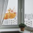 Cuadro de ventana de pareja con calabaza otoñal