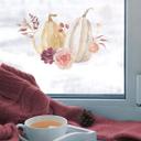 Elegante decoración de ventana con calabazas