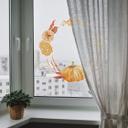 Cuadro de ventana con corona otoñal dorada