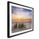 Póster duna en la playa al atardecer