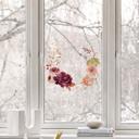 Cuadro de ventana: flores en una corona de otoño