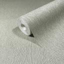 Papel pintado no tejido de aspecto textil con superficie texturada verde liso