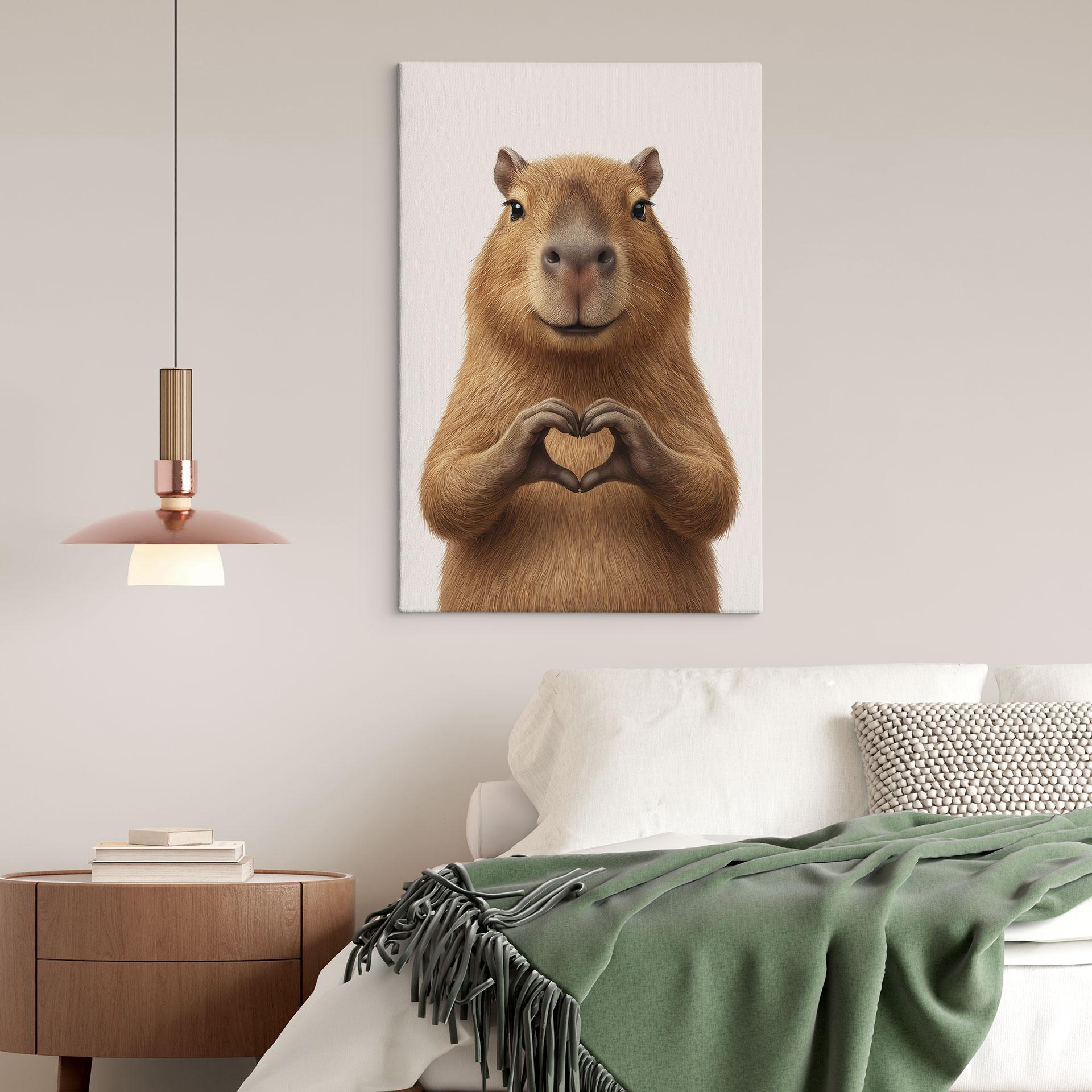 Canvasbillede Capybara med hjertehånd