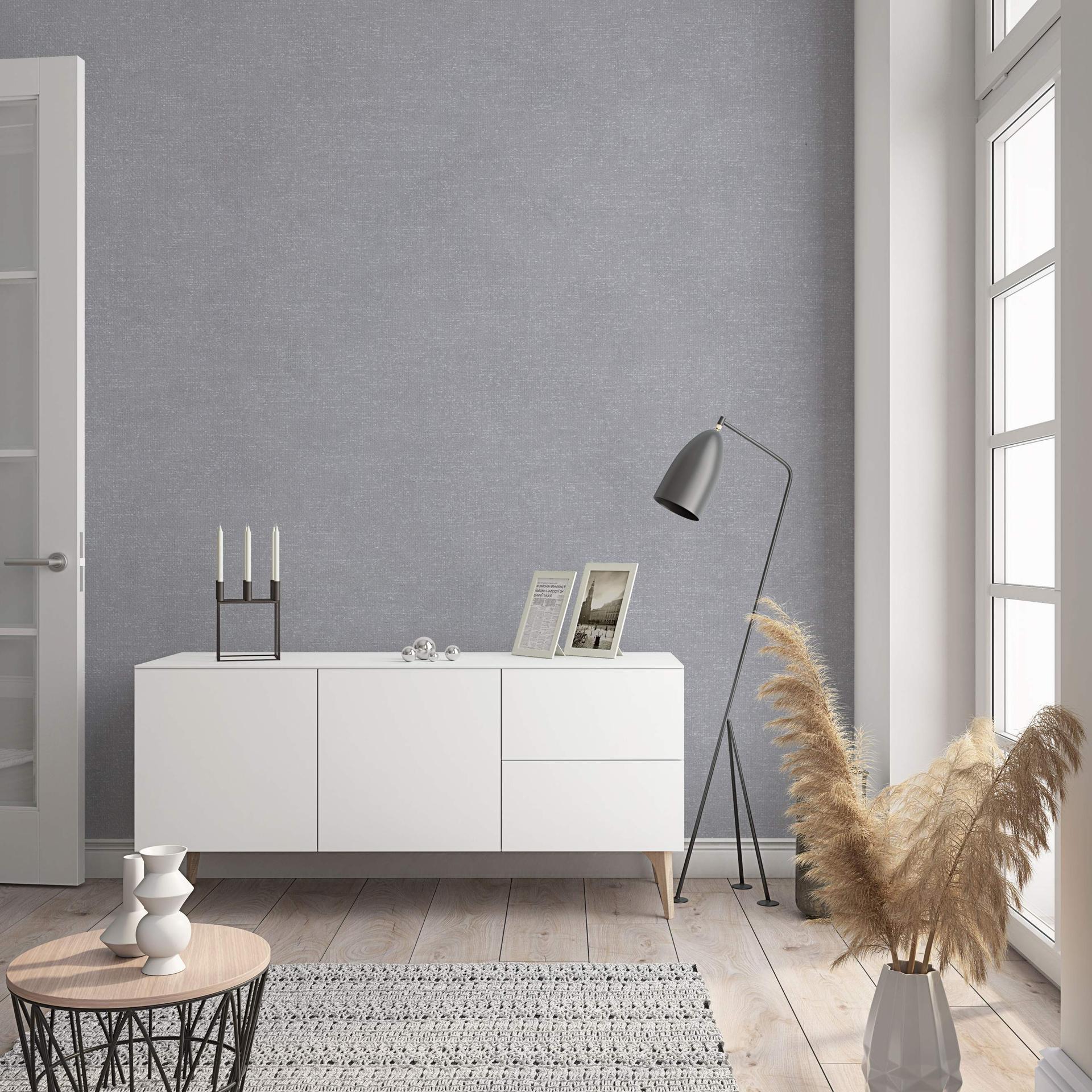 Non-woven tapet med moderne monokromt look og struktur i ensfarvet grå