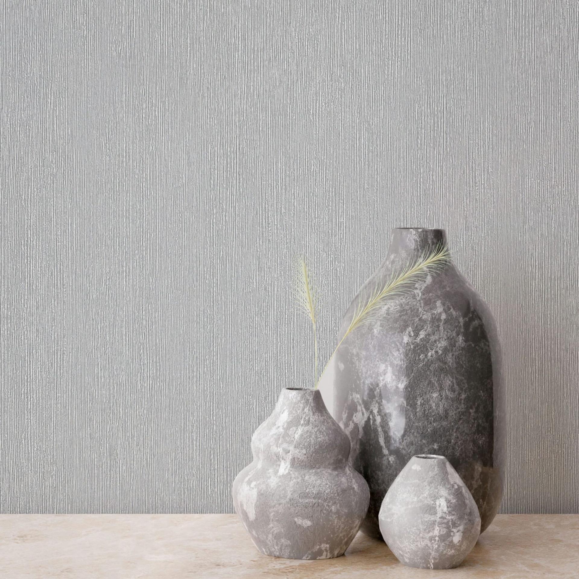 Non-woven tapet i tekstil-look med struktureret overflade grå ensfarvet