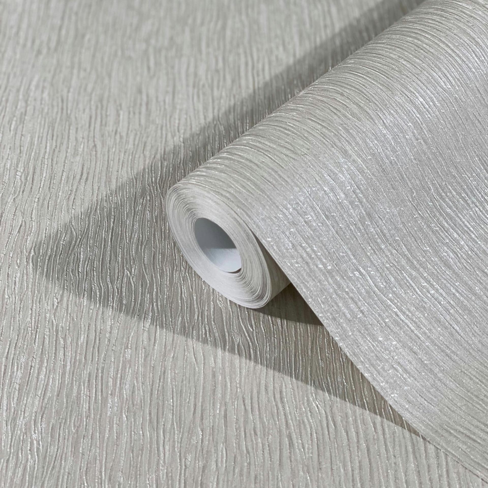 Non-woven tapet med lys struktur i ensfarvet grå