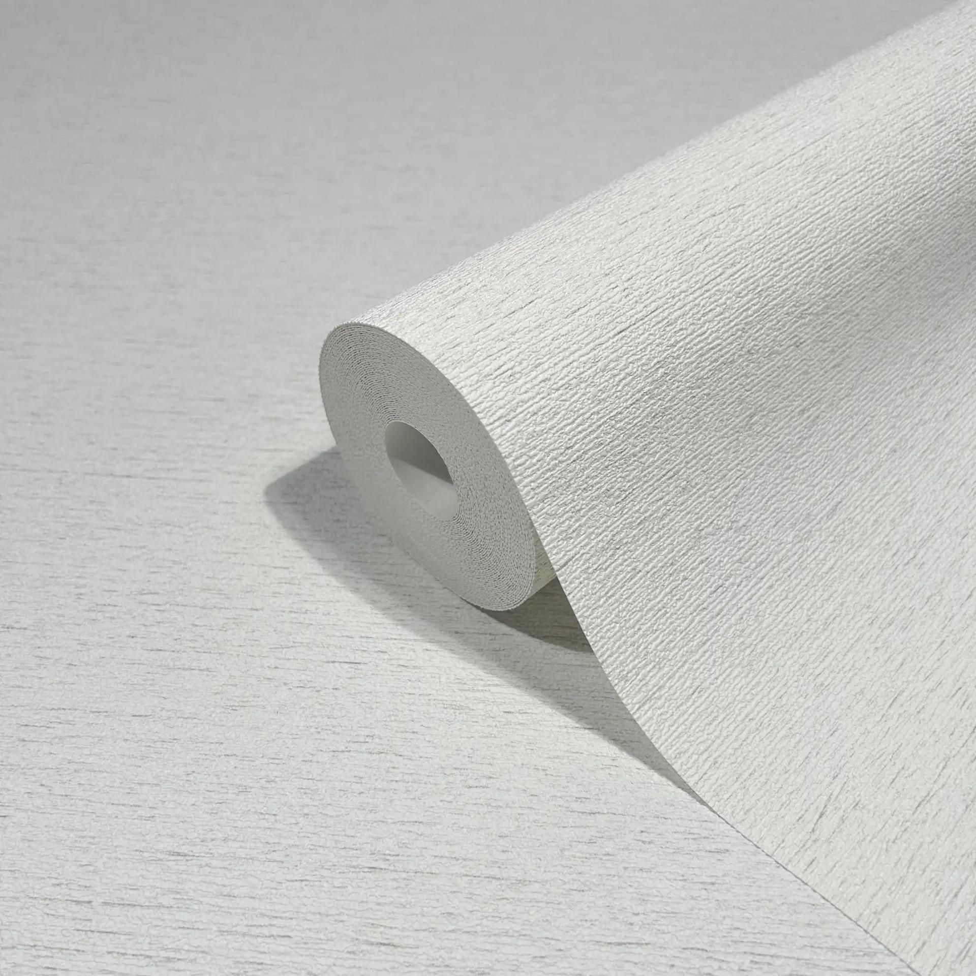 Vliesbehang in een licht gevlekte look als effen wit structuur