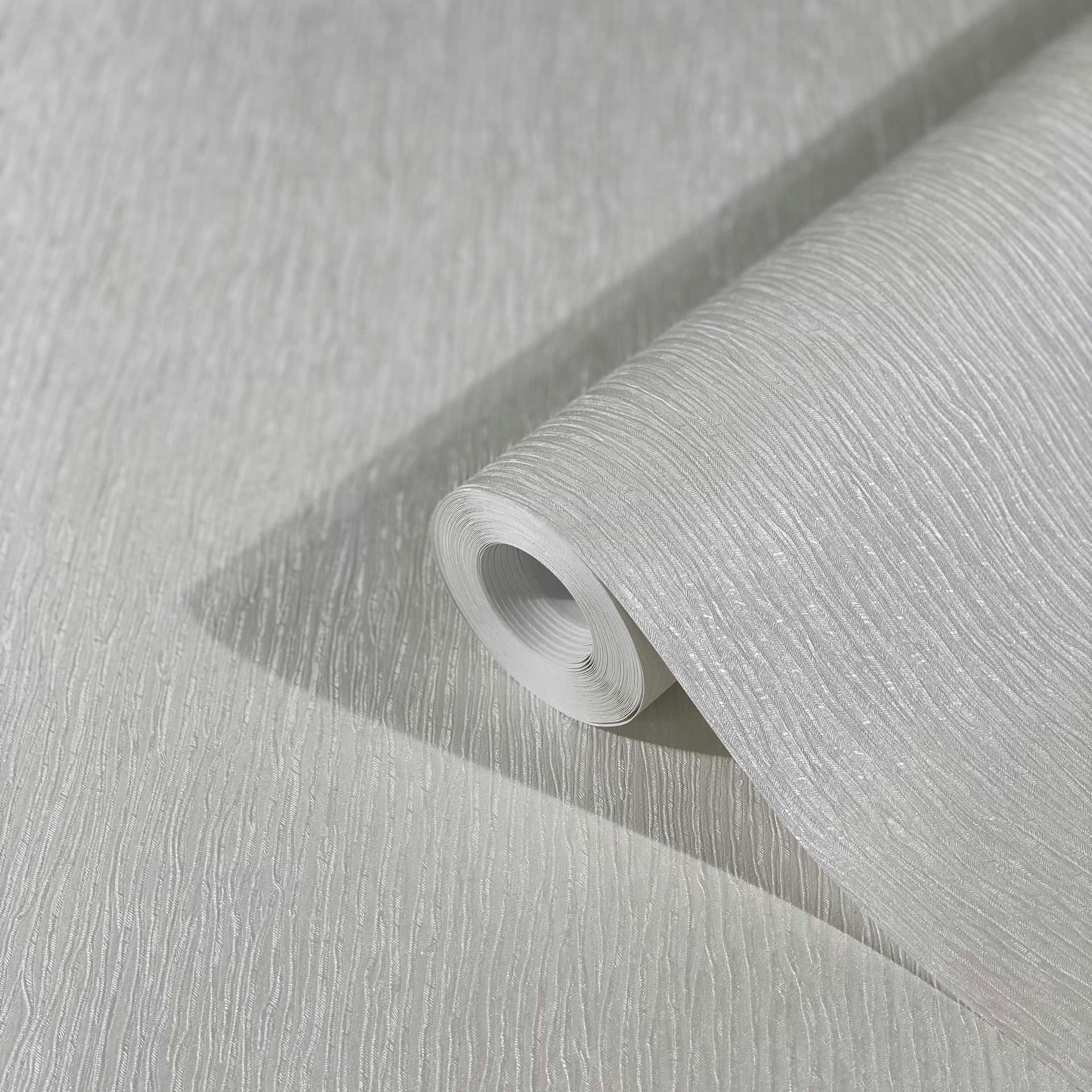 Non-woven tapet med let struktureret effekt i ensfarvet gråt strukturmønster