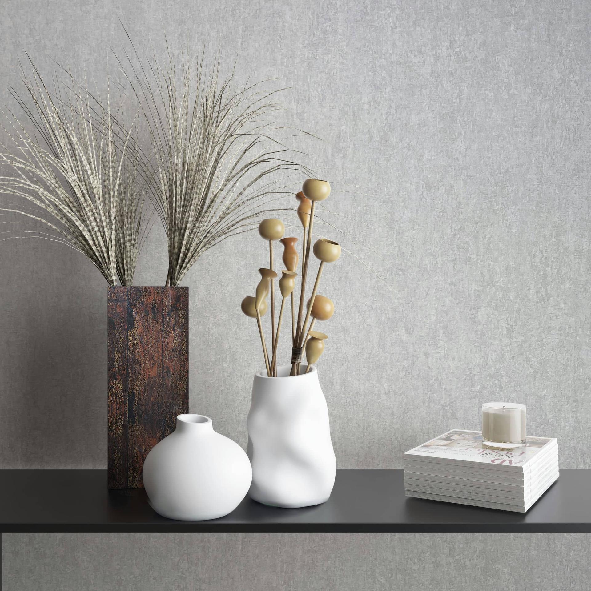 Non-woven tapet med mat, let struktureret gråt betonlook