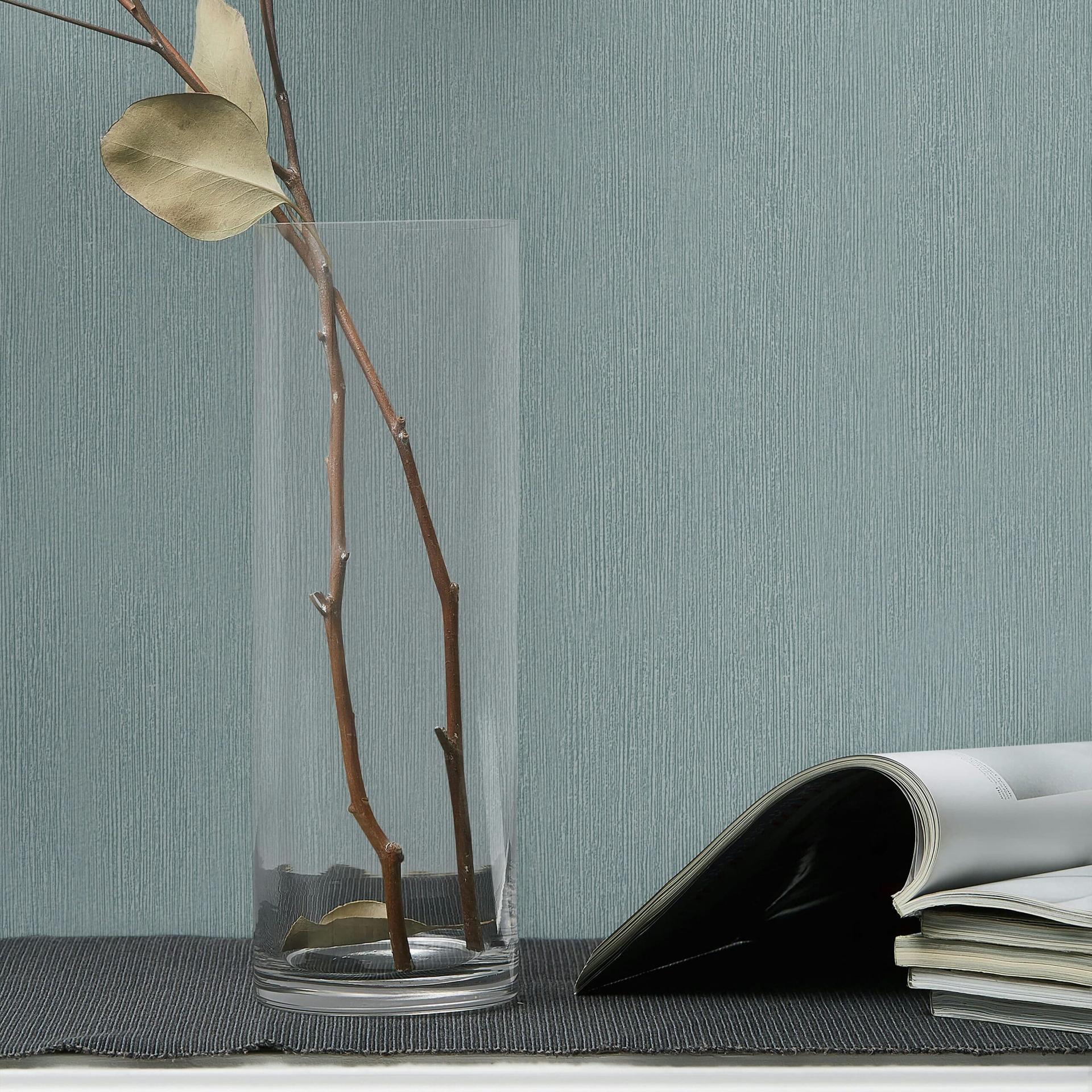 Non-woven tapet i tekstil look med struktureret overflade blå ensfarvet