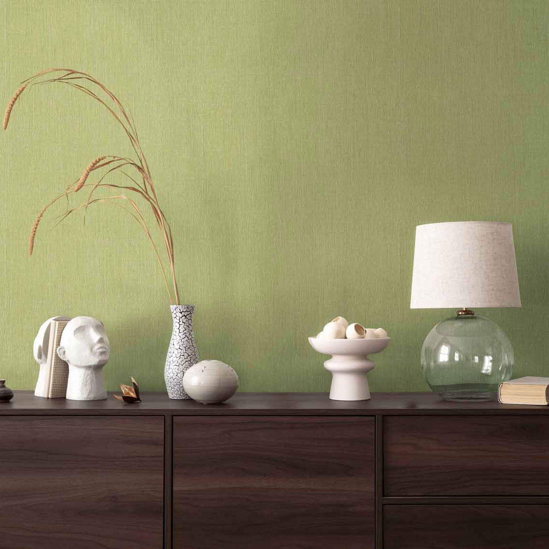 Alegre papel pintado de tejido-no tejido en verde hierba con una sutil textura - Diseño mural vigorizante