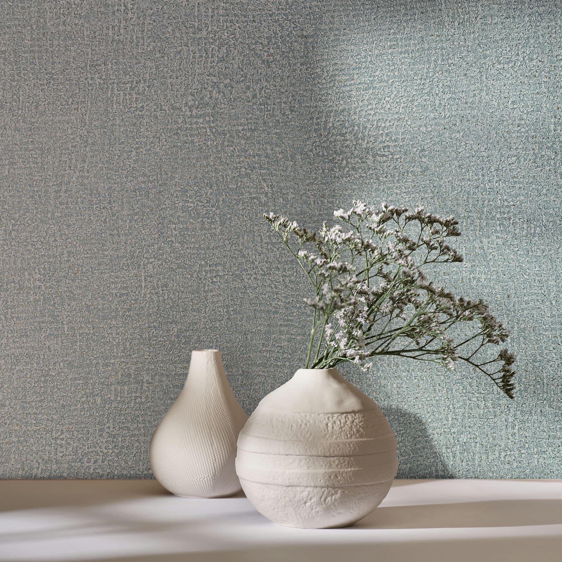 Papel pintado de tejido-no-tejido de color azul con textura textil de aspecto liso