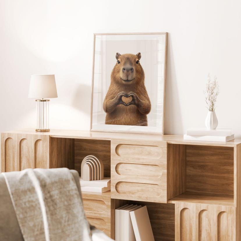 Poster Capybara avec main en forme de cœur