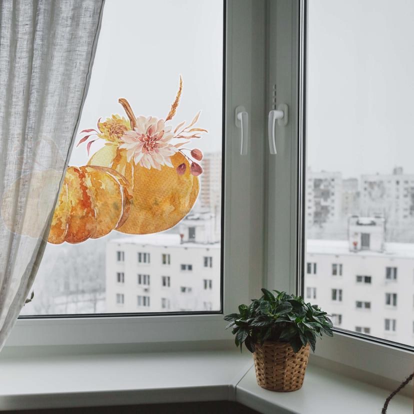 Cuadro de ventana de pareja con calabaza otoñal
