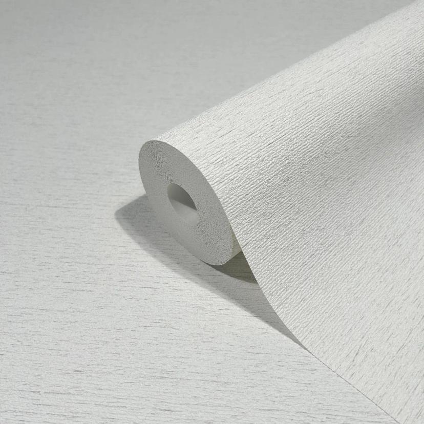 Vliesbehang in een licht gevlekte look als effen wit structuur