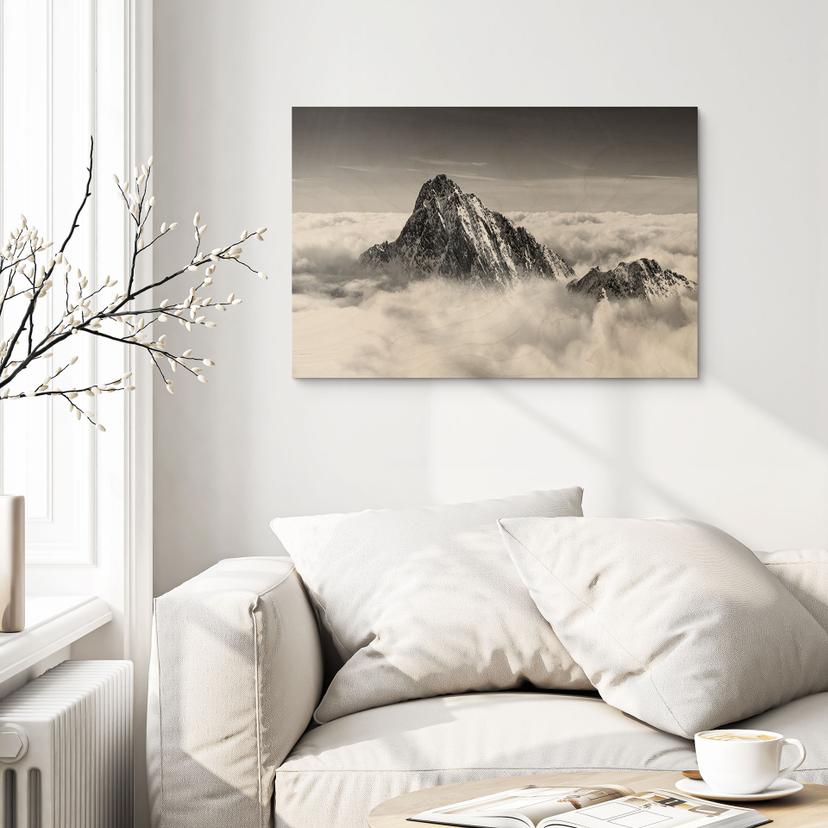 Stampa su legno Picco della montagna sopra le nuvole bianche