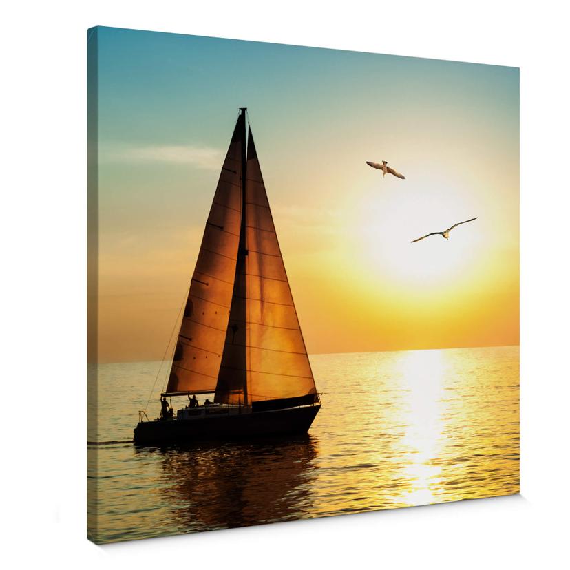 Tableau sur toile Voilier sous coucher de soleil - carré