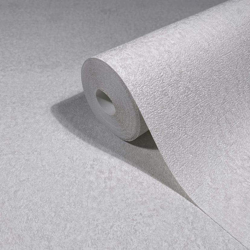 Non-woven tapet i vitt, grå strukturerad puts ser slät ut