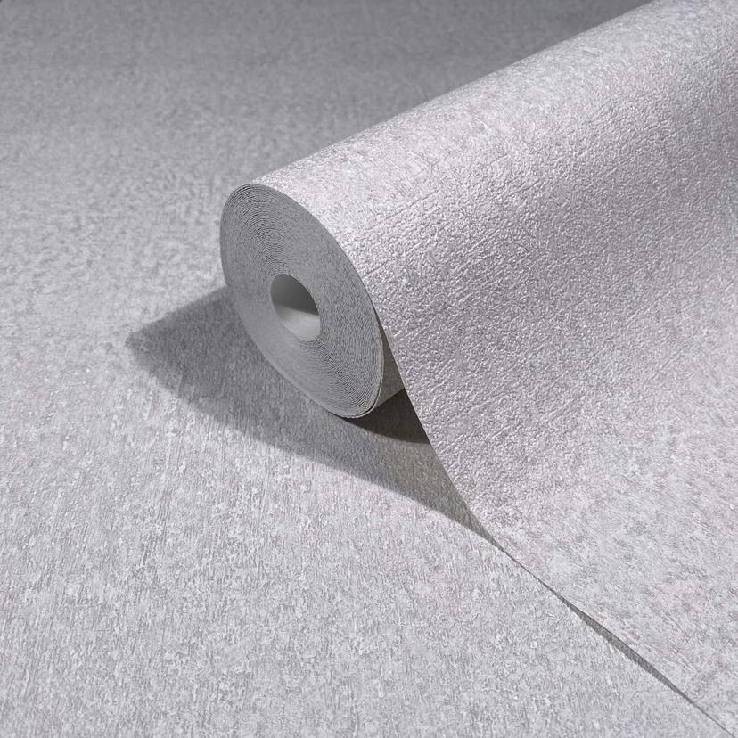 Non-woven tapet i grått, vit strukturerad gips ser vanlig ut
