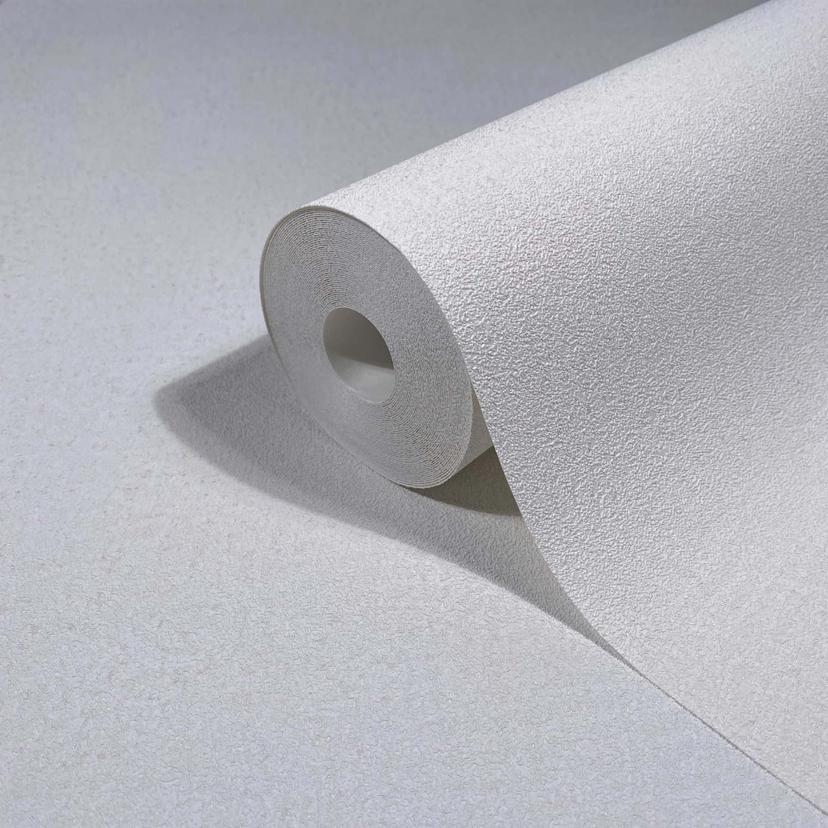 Non-woven tapet i vit texturerad textil med putsad look
