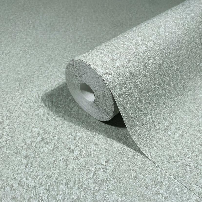 Non-woven tapet i grönt strukturerat gips ser vanligt ut