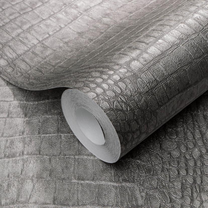 Papel pintado no tejido en gris con aspecto de cocodrilo, discretamente moderno y de llamativa textu