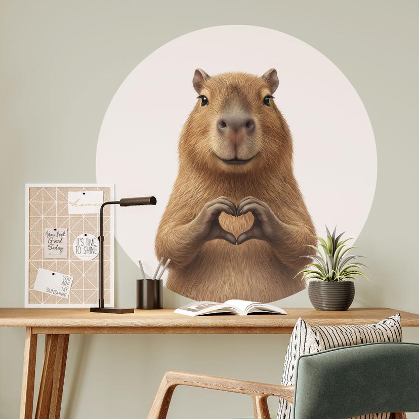 Sticker mural Capybara avec main en cœur - rond
