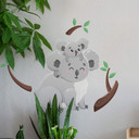 Muursticker Koala op de rug van papa