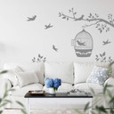 Sticker mural - Silhouette d'une branche avec cage