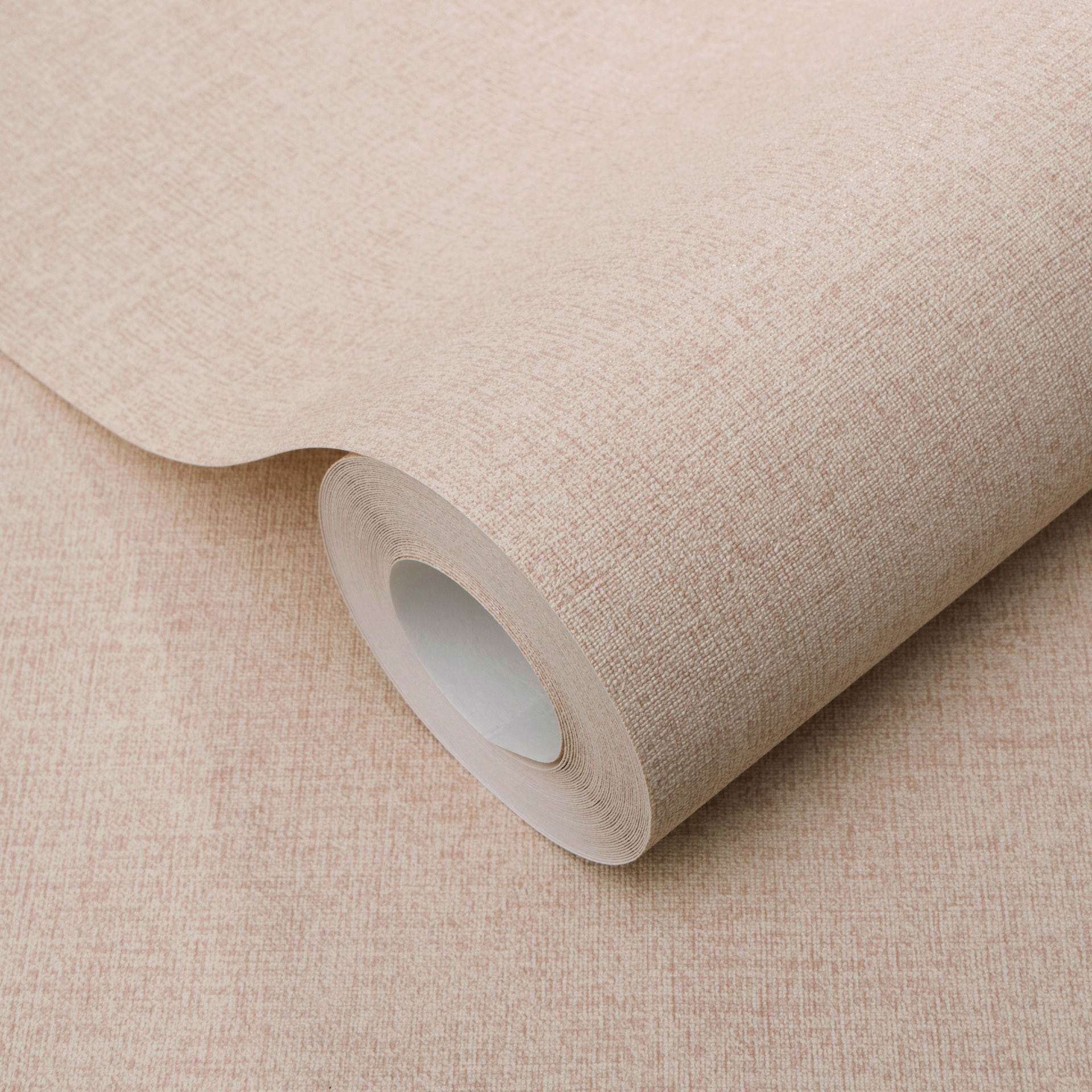Vliesbehang effen roze-beige met een fijne linnenstructuur, subtiel modern en elegant
