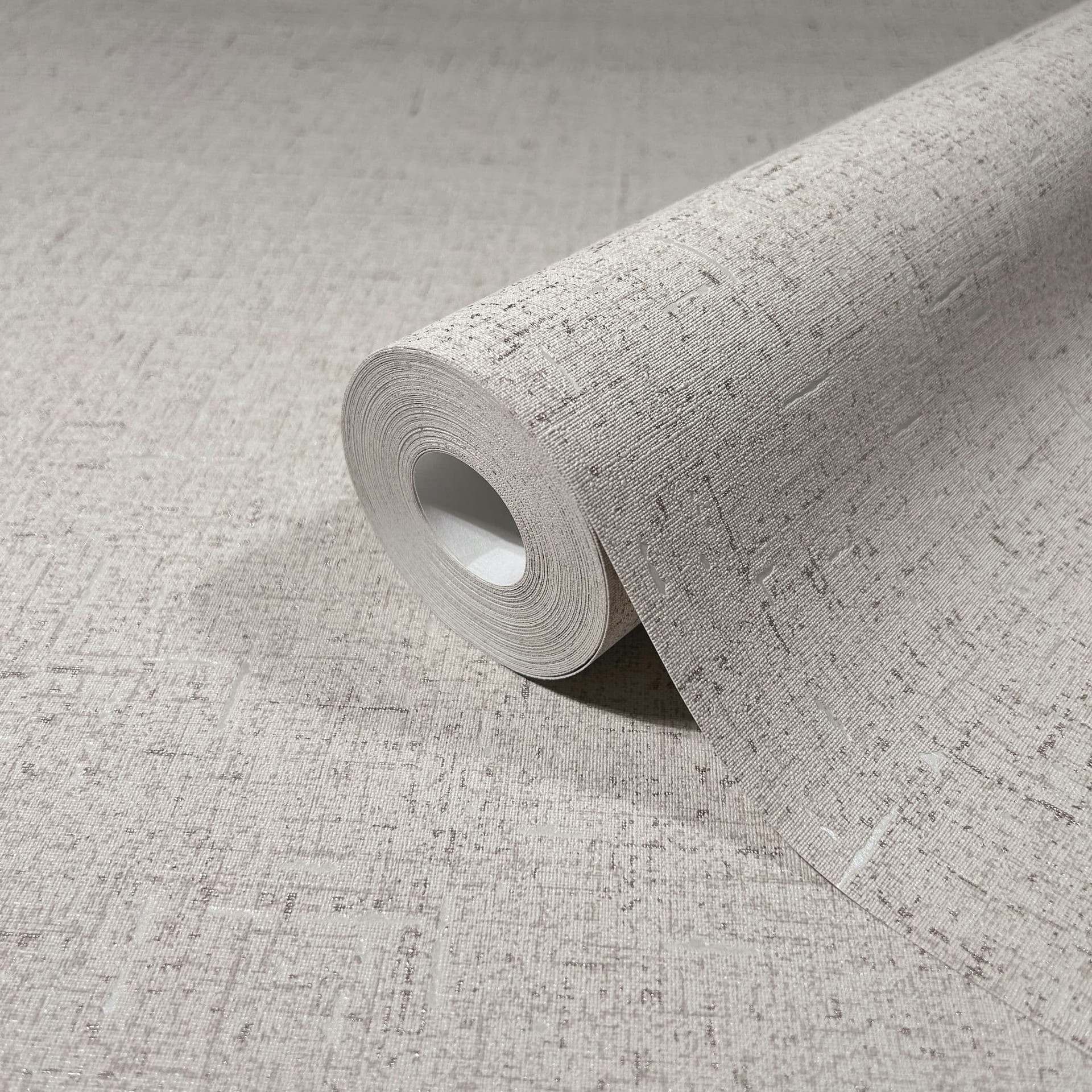 Vliesbehang met een licht glanzende beige, grijze effen structuur