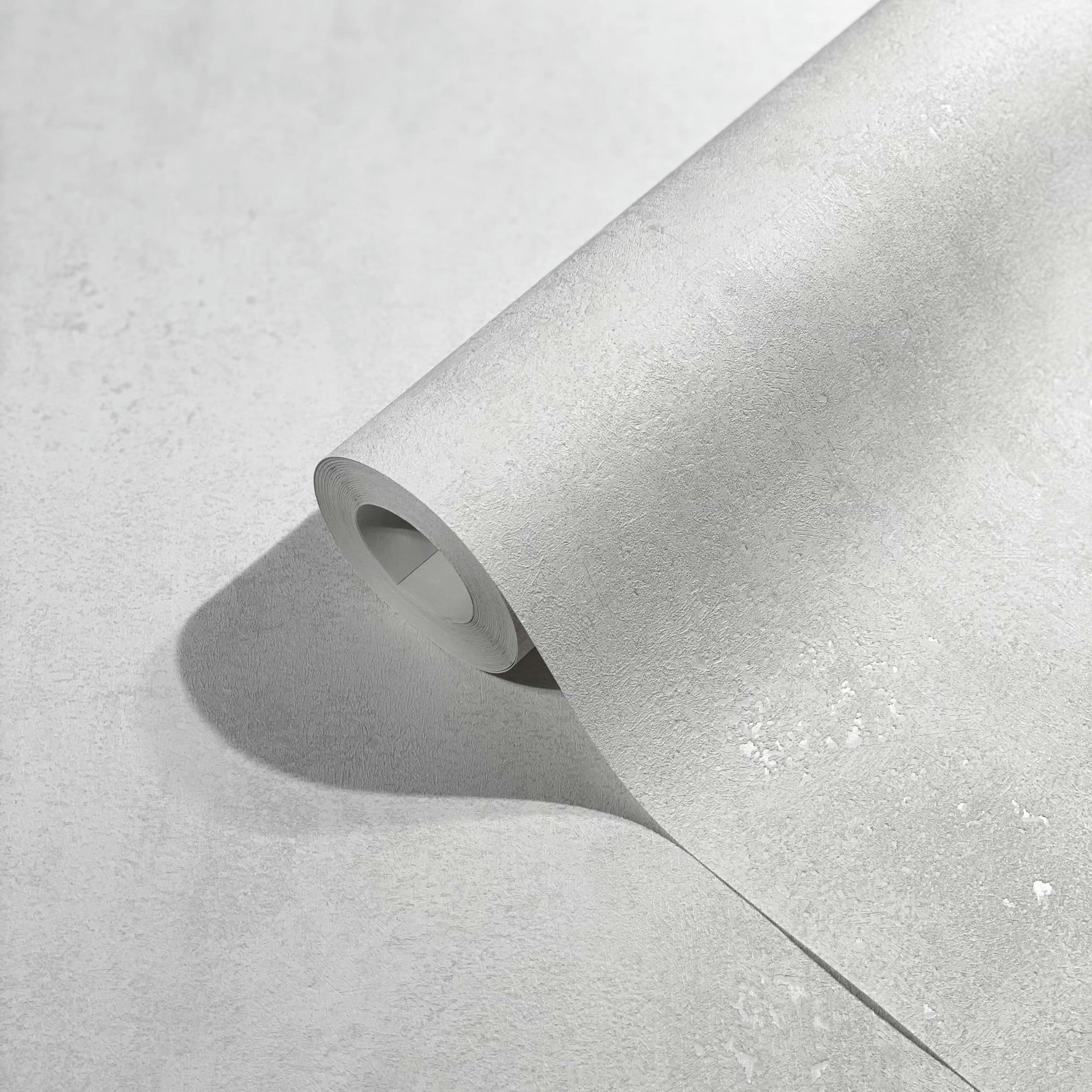 Vliesbehang met licht metallic effect in effen grijze structuurmotieven