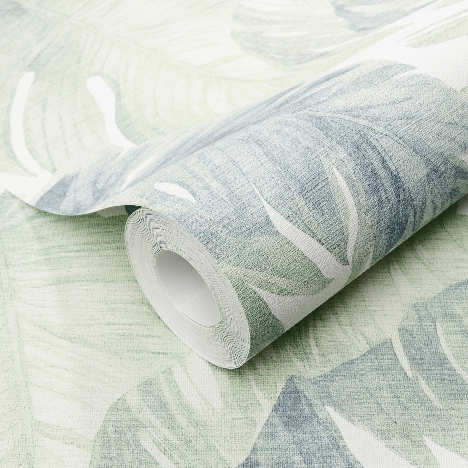 Vliesbehang bladeren in groen blauw tropisch subtiel modern botanisch