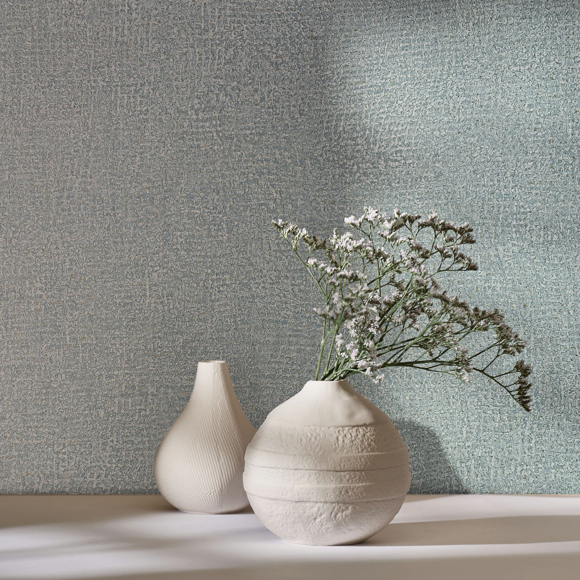 Vliesbehang in blauw structuurtextiel gipslook effen
