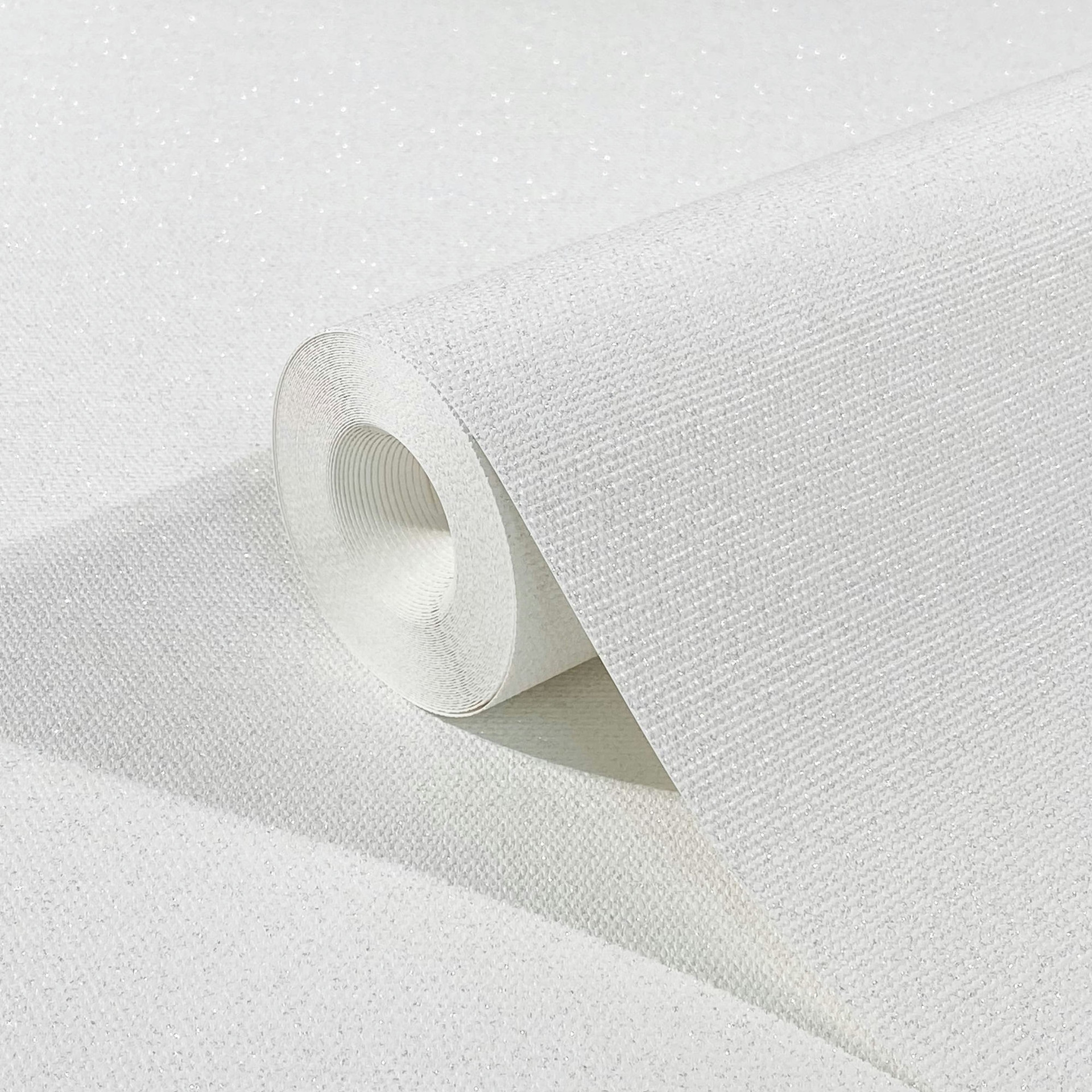 Vliesbehang met een lichte textiellook in een effen witte structuur